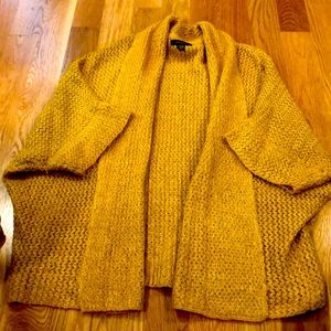 Mustered yellow knit sweater.